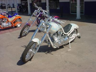 three custom motorcycles