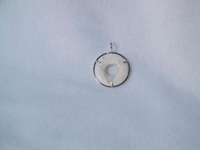 This howlite donut is prong set inside a square wire circle.  Approx. 3cm diam. not for sale.