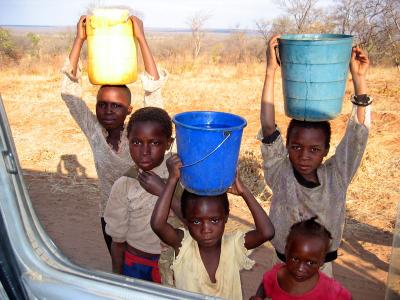 Kids bringing water home