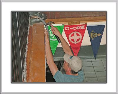 This is how a car dealer holds a hammer (the best thing about Craig work habbits - he's ALWAYS there!)