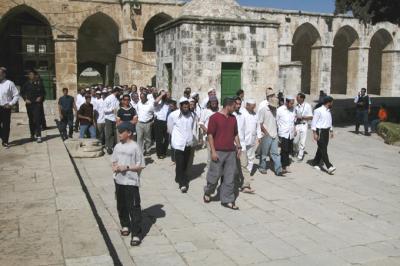 A group of Jewish visitors enter the Mount.