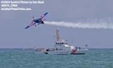 2004 -Red Bull aerobatic aircraft and CGC BLUEFIN (WPB 87318) at the Air & Sea Show - Coast Guard and aviation stock photo #0074