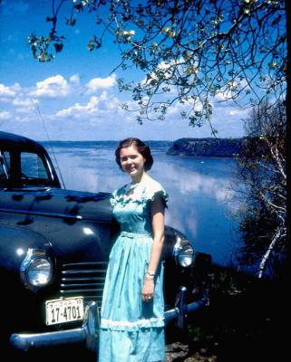 Susan above river with Bob's first automobile, a used 1940 Chrysler