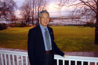 On the porch of Gracie Mansion at dusk -- there is a  spectacular  view of Hell's Gate