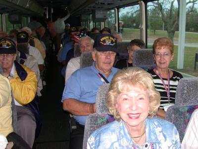 Frank Dowling on the right in the blue shirt, and his wife Faye sitting beside him.