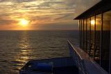 DSC01754 - Sunset reflecting in the window of the ship.