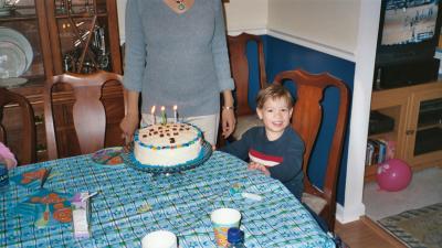 Ben and his cake on his 3rd birthday