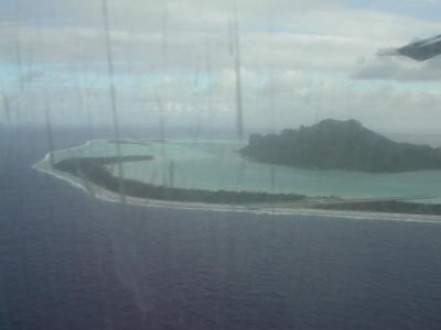 Maupiti atoll through a scatched airplane window