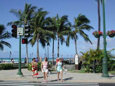 girls crossing the street near the beach at Waikiki
