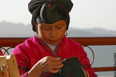 Yao Woman working on hand stitching