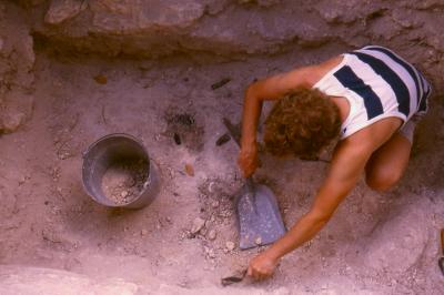 Ross Carter cleaning around Structure 8 burial goods