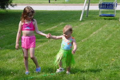 Brenna & Rory approaching the sprinkler