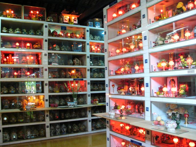 Ashes held in urns with offerings