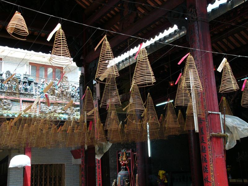 Spirals of incense hung from the ceiling