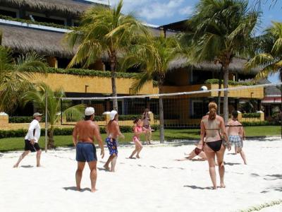 Beach volleyball with Tucan oceanfront suites in the background