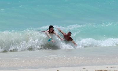 Mike and Phil playing in the waves