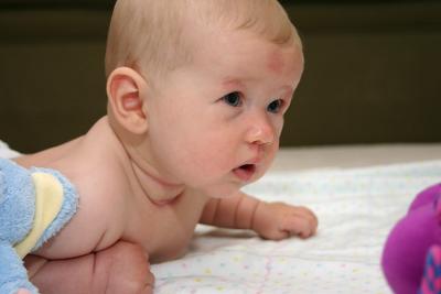 Look at me. I'm raising my head during tummy time.