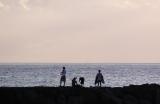 Fishing on the breakwater at Pokai Beach