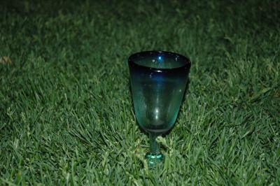 sangria margarita glass growing out of the lawn