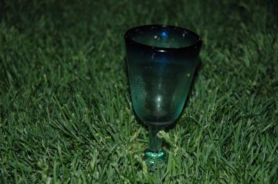 sangria margarita glass growing out of the lawn