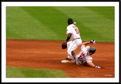 Gabe Kapler disrupts Oriole shortstop Miguel Tejada, who drops the ball causing everyone to be safe. Even $12 million dollar shortstops make errors. Tejada had two in the game.