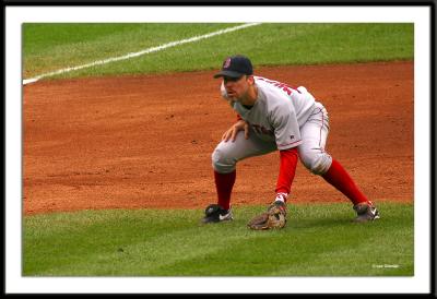 Red Sox third baseman Bill Mueller gets set for the pitch.