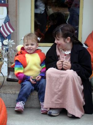 The girls rest after getting some treats. The Harvest festival in Jacksonville, Oregon is always a favorite autumn stop. This is an annual event with a children's costume parade and trick or treat from all the merchants.