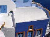a blue house armed by blue walls, surrounded by blue sea