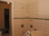 tiled up to the architrave