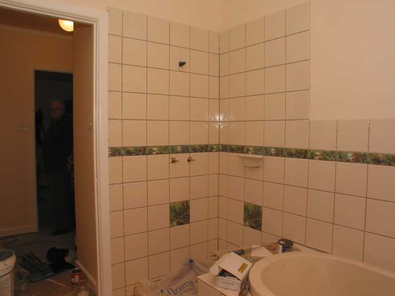 tiled up to the architrave