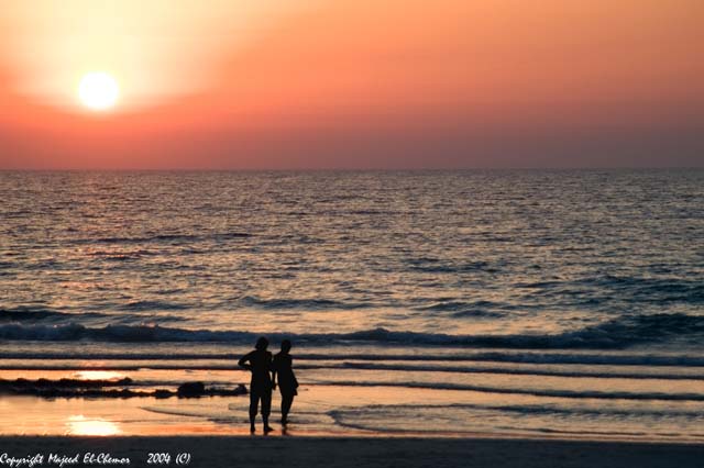 a couple and a sunset