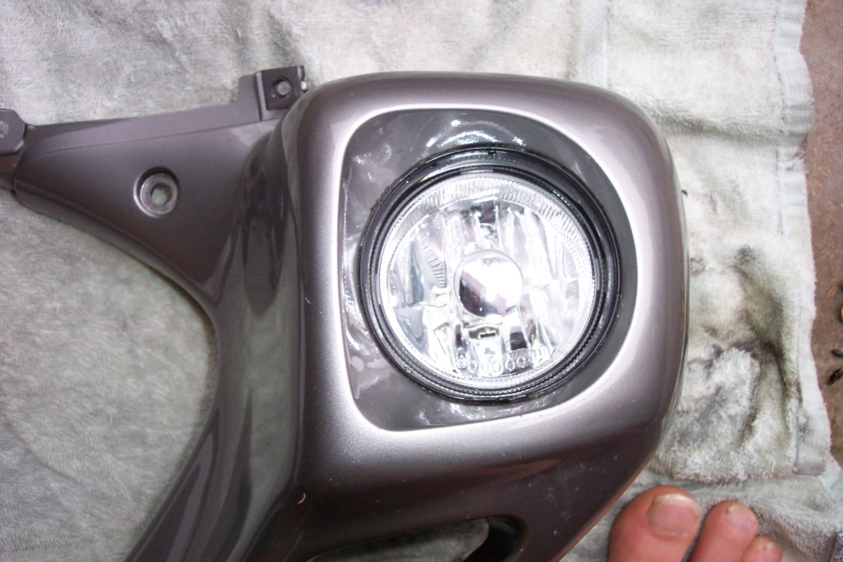 Front view. Make sure the word TOP on the top of the light is at the top of the cowl