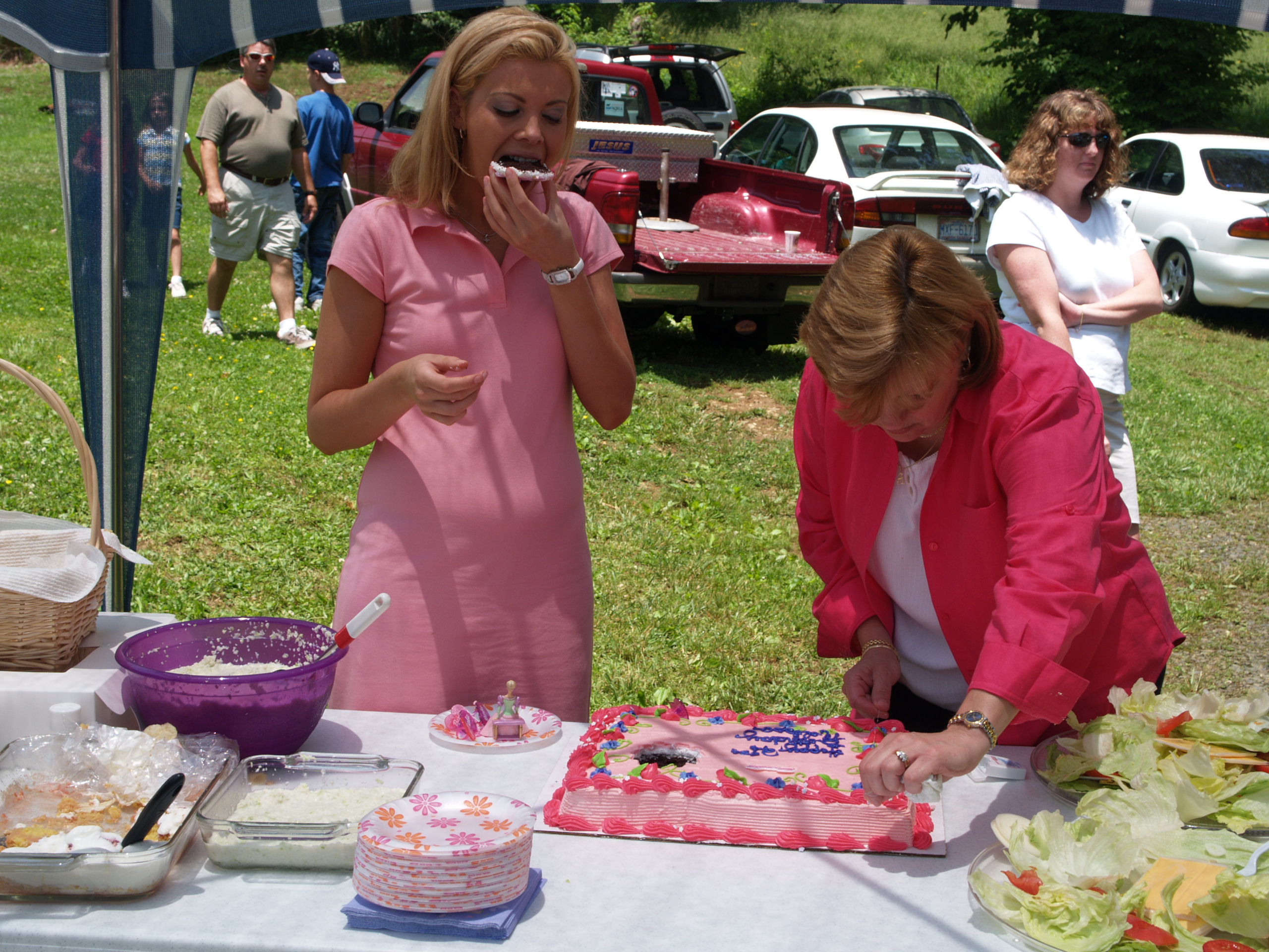 Birthday girl eating Bday cake & mom