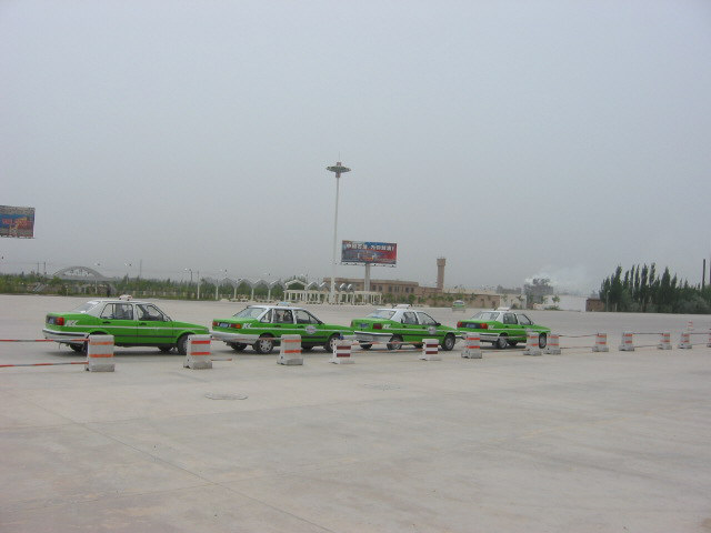 Bustling Kashgar airport parking lot.jpg