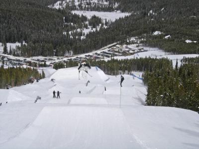 A free style skier coming of a ramp