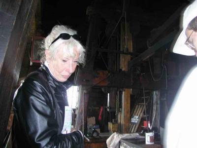 Martha is showing her interest in the functioning of the mill