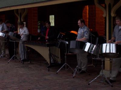 Most of the steel drum band. Luman's granddaughter plays in the back dark area - other shots of her later that I went around back to take.