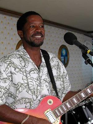 Robert Smith entertains on deck next to Neptune's Pool