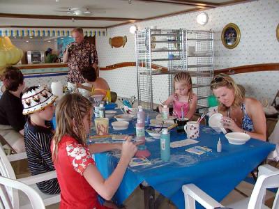 Kids of all ages enjoy ceramic painting at the Pottery Cart.