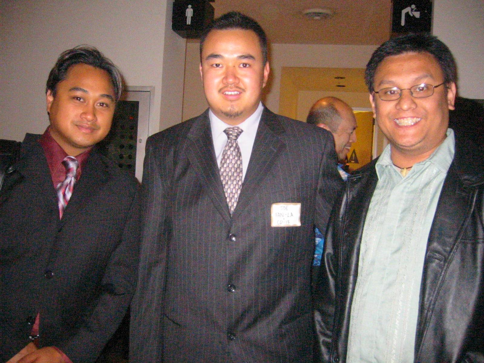 With two fellow friends.