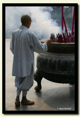 Monk at the Incense pot, Fa Men Si, Shaangxi