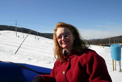 Joann in tube heading up toe lift
