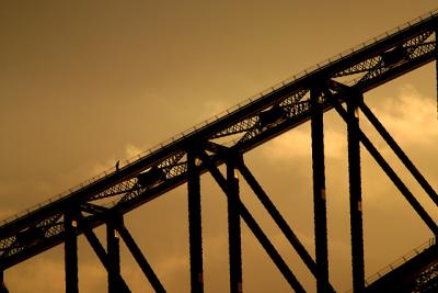 Lone bridgeclimber at sunset