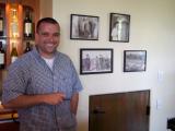 The proud owner, and his winery heritage on the wall