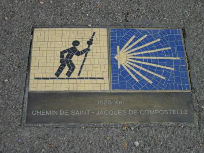 A sign marking the distance for pilgrims to Santiago de Compostella.