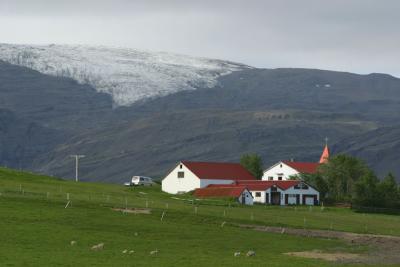 Typical pristine farmhouse, with glacier behind