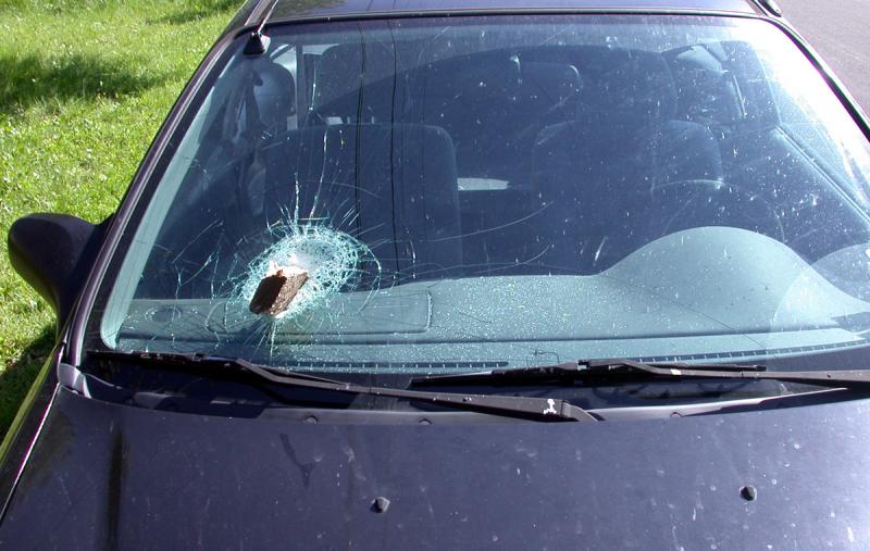 Board falls off a truck - lodges in windshield