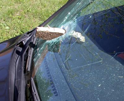 Board falls off a truck - lodges in windshield