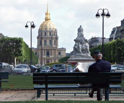 Studying the morning paper near Les Invalides