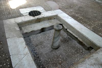 A remodeled pool. The original tile is on the bottom. The marble (now broken) was installed later.